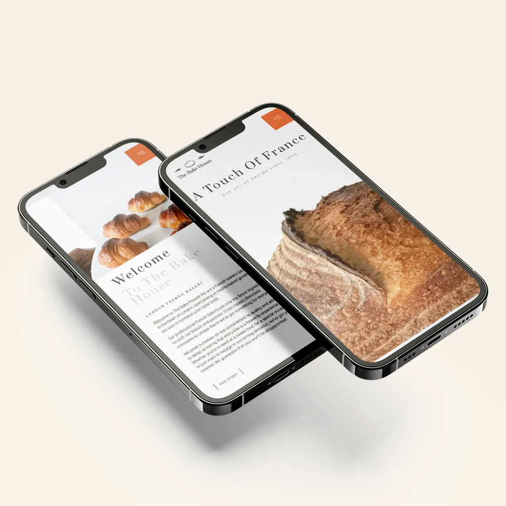 a couple of cell phones with a website on the screen